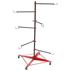 a red and black metal pole with multiple hooks on it's sides, attached to a white background