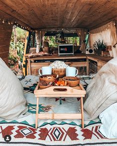 the interior of a camper with two trays of food on top of it