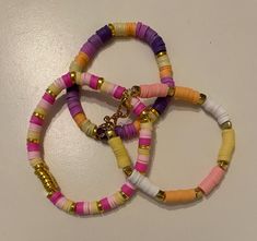 You should totally buy that three-pack of sunset-themed clay bead bracelets because they're a perfect way to capture the warm, vibrant colors of a beautiful sunset! The blend of oranges, pinks, and yellows will add a stunning pop to your outfits and give you that relaxed summer vibe. Plus, they're versatile enough to wear for any occasion, whether you're going to the beach or hanging out with friends. With these bracelets, you can easily express your unique style while staying comfortable all da Clay Bead Bracelets, Going To The Beach, Sunset Lover, Clay Bead, Bead Bracelets, Clay Beads, Beautiful Sunset, Festival Season, Summer Vibes