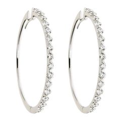 These versatile 18kt white gold large hoop earrings feature 4.86cts of sparkling round diamonds. The skilled setting with only two prongs securing the diamonds, make them light and wearable all day long. Handcrafted in Italy by ZYDO Italian Jewelry.Diamond Quality: Color F, Clarity VSDiamond Carat Weight: 4.86Dimension: Diameter: 2 in. Italian Jewelry, Large Hoop Earrings, Jewelry Diamond, Classic Chic, Pendant Rings, Ring Collections, Boutique Jewelry, High Quality Jewelry, Round Diamonds