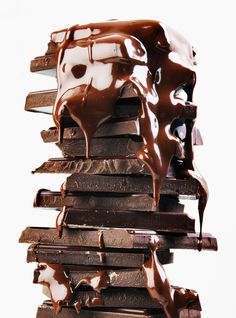 a stack of chocolate bars covered in melted chocolate