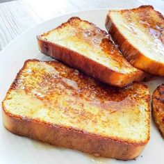 four pieces of french toast on a white plate