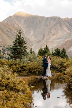 Bride and groom embrace one another surrounded by large mountain views and their reflection is visible in a little pond. Loveland Pass Engagement Photos, Loveland Pass Elopement, Loveland Pass Colorado, Denver Elopement, Ski Wedding, Colorado Mountain Elopement, Elopement Shoot, Elopement Colorado, Travel Photoshoot