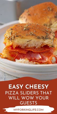 a close up of a sandwich on a plate with the words easy cheesy pizza sliders that will wow your guests