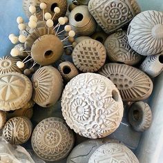 some very pretty looking vases that are made out of clay and sea urns