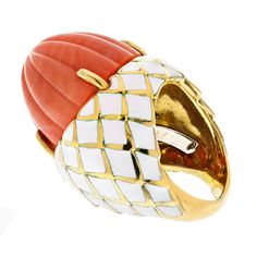 The 18k yellow gold ring by David Webb is a striking and unique piece of jewelry that showcases the exceptional craftsmanship and attention to detail for which the David Webb brand is known. This ring features a carved coral stone in the center, which is mounted in a yellow gold setting that has been expertly applied w Emerald Cut Diamond Ring, David Webb, Yellow Rings, Yellow Jewelry, The David, Coral Stone, Checkerboard Pattern, Yellow Gold Setting, 18k Yellow Gold Ring