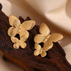 These Large Gold Butterfly Earrings make a bold statement with their stunning design. Perfect for adding a touch of elegance and sophistication to any outfit. These earrings will surely catch attention and elevate any look. DETAILS & SIZE Sold as a pair Finish: 18K gold plate Material: Stainless Steel Measurements: 1.6"x1.2" Weight: 12.6 grams Comes with friction earring backs Waterproof, tarnish-resistant, and nickel free Shop Earrings to curate your ear stack! Tarnish-resistant Gold Clip-on Earrings, Yellow Gold Plated Bridal Earrings, Yellow Gold Plated Clip-on Earrings, Gold Plated Earrings For Party, Elegant Butterfly Earrings For Formal Occasions, Elegant Gold Butterfly Earrings, Elegant Gold Butterfly-shaped Earrings, Gold Plated Single Bridal Earring, Luxury Gold Bridal Earrings Pierced