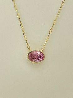 Add a touch of sophistication and elegance to your style with this stunning 3.20ct Oval Pink Spinel Necklace. The pendant features a beautiful oval Spinel stone that exudes a pink hue and is set in a 14kt Yellow Gold base metal. The necklace is designed by JewelsOfNewYork and boasts a pendant style that adds a touch of glamour to any outfit. The necklace is ideal for any occasion, from formal events to everyday wear. The remarkable color of the Spinel stone, combined with the yellow gold metal, creates a dazzling effect that will surely impress. With this necklace, you can elevate your fashion sense and add a unique piece to your jewelry collection. Spinel Necklace, Spinel Stone, Pretty Accessories, Pink Spinel, Solid Gold Necklace, Wedding Jewellery, Pink Stone, Stylish Jewelry, Base Metal