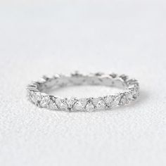 a white gold wedding band with five diamonds