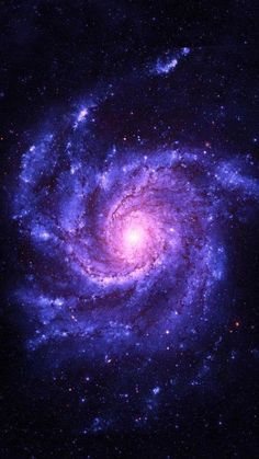 an image of a spiral galaxy in the night sky with blue and purple stars around it