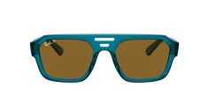 Experience the perfect blend of style and sustainability with Ray-Ban Corrigan Bio-Based sunglasses. These irregular-shaped glasses feature a polished transparent light blue acetate frame that contrasts beautifully with the dark brown polarized lenses. The shades not only look great but also offer superior protection from the sun's rays. Embrace a more eco-friendly lifestyle while remaining fashion-forward with these unique shades. Sunglasses Transparent, High Cheekbones, Blue Lens, Blue Lenses, Unisex Sunglasses, Polarized Lenses, Ray Ban Sunglasses, Front Design, Prescription Lenses