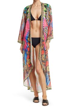 Unleash your free boho spirit in this longline open front kimono styled with vivid patterns. Open front Kimono sleeves All-over print Woven 100% polyester Hand wash cold, line dry Imported Model stats: 5'10", 32" bust, 25" waist, 36" hip. Model is wearing one size. Multicolor Wrap Kaftan For Festival, Hippie Open Front Kaftan For Vacation, Hippie Open Front Kaftan For Beach Cover-up, Boho Print Open Front Cover-up For Beach Season, Multicolor Open Front Kaftan For Beach, Summer Festival Open Front Kaftan, Spring Hippie Open Front Kaftan, Spring Open Front Hippie Kaftan, Multicolor Kimono-sleeved Cover-up For Festivals