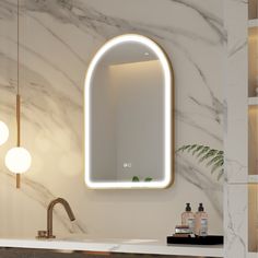 a bathroom sink with a mirror above it and lights on the wall next to it