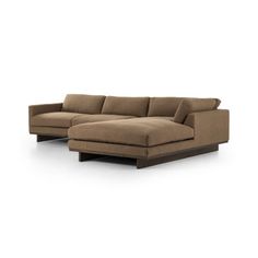 a large sectional couch sitting on top of a white floor