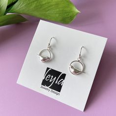 Dangle silver ring & bird earrings |delicate silver bird earrings |baby bird |new mom gift |freedom |bird jewelry |cool bird earrings silver bird earrings |  These delicate silver bird earrings are very comfortable and light to wear, a unique piece of jewelry that will add character to any look. Ideal as a gift to yourself or someone special. They are completely handmade and the birds are carved in wax and caste in silver. Dimensions Circle with the bird: 1.2 x 1.2 cm Drop length: 1.2 cm materia Different Jewelry, Freedom Bird, Bird Watcher Gifts, Unicorn Earrings, Silver Bird, Baby Bird, Bird Earrings, Tiny Stud Earrings, Bird Jewelry