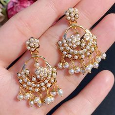 Featuring a chandbali design pendant with delicate chandbali earrings in 22ct gold. It has been set with precious freshwater pearls. It weighs 19.52 GMs including 1.75 GMs of hanging pearls. This timeless design makes it perfect for any outfit, from traditional wear to modern styles - a great choice for any occasion. Pearl Pendant Set, 22k Gold Jewelry Necklaces, 22k Gold Jewelry, Chandbali Earrings, Pearl Necklace Set, 22 Carat Gold, Gold Jewelry Necklace, Emerald Necklace, Gold Bangle Bracelet