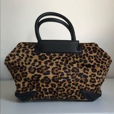 This Bag Has The Versatility To Be Worn On The Shoulder With An Adjustable Leather Strap Or Carried By Hand. It Is Real Calf Hair, With Black Leather And Golden Details. It Has Internal Lining With Pockets For Extra Convenience! At An Amazing Price, This Bag Is Unused, Comes With Original Strap And Dustbag. Designer Leopard Print Travel Bag, Designer Leopard Print Bag For Everyday Use, Chic Leopard Print Bags For Errands, Chic Tortoiseshell Leather Bag, Tortoiseshell Bags For Everyday Use, Chic Tortoiseshell Bag For Everyday Use, Chic Leopard Print Shoulder Bag With Leather Handles, Chic Tortoiseshell Bag, Luxury Tortoiseshell Rectangular Bags