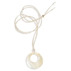 Genuine mother-of-pearl shell circle pendant on an adjustable cream cord. *Shell pendants are natural and may vary slightly in color. MEASUREMENTS Chain length: Adjustable from 14 inches - 38 inches Charm measurements: 40 x 40 mm MATERIALS Chain material: Cotton Charm material: Genuine mother-of-pearl, freshwater pearl Heart Locket Necklace, Mother Of Pearl Necklace, Pearl Necklaces, Jewelry Lookbook, Custom Name Necklace, Shell Necklace, Shell Jewelry, Circle Necklace, Unisex Jewelry