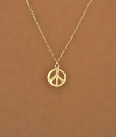 Gold peace sign necklace - peace necklace - delicate and dainty - a 14k gold plated little gold peace symbol on a 14k gold filled chain A cute little 14k gold overlay peace sign hangs from a 16 inch 14k gold filled chain. Please feel free to select a different length chain if you prefer! Also available in sterling silver! The peace sign measures 12mm. Looking for other charm necklaces? https://www.etsy.com/shop/BubuRuby?section_id=12318467 More from Bubu Ruby? https://www.etsy.com/shop/BubuRuby? Gold Peace Sign Jewelry Gift, Gold Jewelry With Peace Sign For Gift, Peace Necklace, Peace Sign Necklace, Sign Necklace, Funky Jewelry, Jewelry Lookbook, Girly Jewelry, Jewelry Inspo