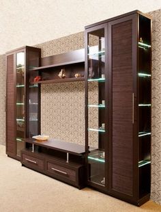 a room with some shelves and drawers in it's center, along with other items on the wall