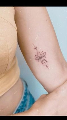 a woman with a small tattoo on her arm