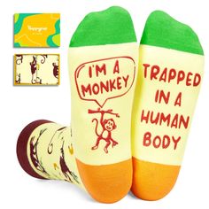 two pairs of socks that say i'm a trapped in a human body and have monkeys on them