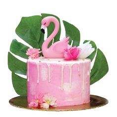 a pink cake with a flamingo decoration on top