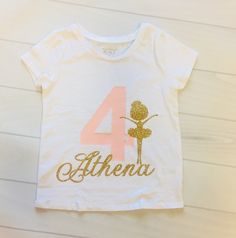 This shirt is perfect for any Ballerina themed Birthday. Made with our beautiful no shed glitter its sure to be a hit! We offer design color changes upon request. Please add Child's name into the order notes Shirt: The Children's Place (100% Cotton) Washing Instructions: Turn inside out, wash on a cold cycle, tumble dry low or hang to dry. Don't forget to LIKE us on Facebook! {https://www.facebook.com/Paytonspinkboutique/} **Tutu {If ordering the SET How to order: Please add size and name into o Customizable White Party Tops, Customizable Short Sleeve Top For Party, Customizable Cotton T-shirt For Party, Fitted Custom Print Tops For Birthday, Pink Glitter Print Top For Birthday, Customizable Fitted T-shirt For Birthdays, Customizable Fitted T-shirt For Birthday, Fitted Top With Name Print For Birthday, Gold Graphic Print Top For Birthday