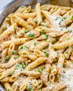 pasta with chicken and parmesan cheese in a pan