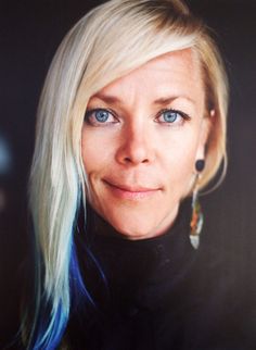 a woman with blonde hair and blue eyes