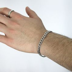 A chunky, classy, and timeless 6mm curb stainless steel chain bracelet that will not tarnish or rust over time, even when worn in the water. 💎Free shipping on all orders💎Waterproof and non-tarnish💎Packaging that is ready to offer as a gift💎Customizable and adjustable chain length A durable, waterproof, and non-tarnish silver chain bracelet This stainless steel handmade chain bracelet is not only waterproof but also resistant to tarnishing and will maintain its shine over the years. You can w Everyday Cuban Link Bracelet With Stainless Steel Clasp, Stainless Steel Cuban Link Bracelet With Chunky Chain, Everyday Cuban Link Bracelet With Curb Chain, Classic Cuban Link Bracelet With Stainless Steel Clasp, Classic Cuban Link Metal Bracelet For Everyday Wear, Classic Cuban Link Metal Bracelet For Everyday, Classic Metal Cuban Link Bracelet For Everyday, Classic Stainless Steel Cuban Link Bracelet As A Gift, Classic Stainless Steel Cuban Link Bracelet As Gift