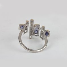 ⚫ This Ring Made With Tanzanite & Diamonds in & 925 Sterling Silver, ⚫ Pave Diamond Gemstone Ring 925 Sterling Silver Jewelry. ⚫ Gemstone Ring, Diamond Ring, Designer Ring, Everyday Jewelry ⚫ Special customize for Mother day, Anniversary, Birthday Gift, Valentine, Christmas. ⚫ Item Details: Gross Weight:4.16 Grams 925 Sterling Silver Weight:3.86 Grams Diamond Weight:0.6 Carats Tanzanite Weight:0.9 Carats Item Size: US 7 (20x23 MM) Item SKU: AROS-1352 Gemstone color may vary due to natura Modern Silver Sapphire Ring With Accent Stones, Modern Silver Cluster Ring With Prong Setting, Modern Silver Sapphire Ring For Anniversary, Modern Sterling Silver Sapphire Ring, Modern Silver Amethyst Ring For Anniversary, Modernist Gemstone Rings For Anniversary, Silver Sapphire Ring In Sterling Silver, Modern Silver Sapphire Ring In 14k White Gold, Modern Silver Diamond Ring With Accent Stones