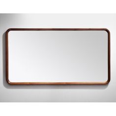 a wooden frame mirror hanging on the wall above it's reflection, with a white background