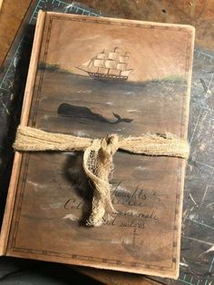 an old book with a rope tied around it