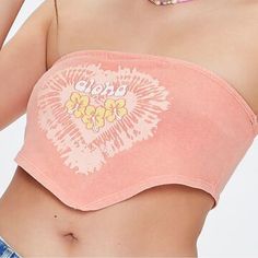 A Knit Tube Top Featuring Front "Aloha" Text, Heart And Floral Graphics, A Straight-Cut Neckline, And Cropped Pointed Hem. Content + Care - 100% Cotton - Machine Wash Cold Size + Fit - Model Is 5'8" And Wearing A Small Trendy Cotton Tube Top For The Beach, Trendy Summer Crop Top With Letter Print, Trendy Letter Print Crop Top For Summer, Trendy Stretch Tube Top For Summer, Trendy Stretch Tube Top For Beach Season, Trendy Bandeau Beach Top, Casual Cotton Beach Tube Top, Trendy Bandeau Top For Beach, Trendy Bandeau Tops For Beach Season