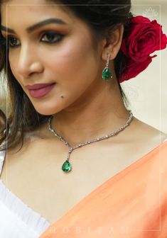 Celebrity-Inspired Emeralad Green  CZ Stone Drop Necklace and Earring Set, a reflection of elegance and allure. This set boasts a striking drop pendant necklace, embellished with sparkling CZ stones that emulate the fiery allure of Emerald green  encrusted in a silver frame and is perfect for a discerning fashionista. This necklace is a true statement of grace and luxury, reminiscent of the red-carpet glamour worn by the most iconic celebrities. Note: This jewelry has no precious metals or stone Green Teardrop Necklace With Matching Earrings, Green Teardrop Jewelry Sets With Matching Earrings, Green Teardrop Necklace For Party, Green Teardrop Jewelry For Celebration, Green Jewelry Sets With Matching Earrings For Celebration, Green Emerald Jewelry Sets, Emerald Jewelry Sets For Celebration, Iconic Celebrities, Beautiful Chokers