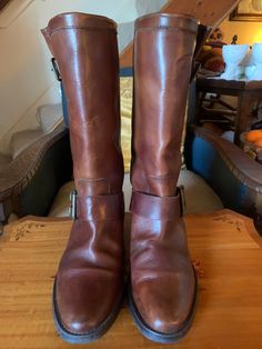 "Vintage Leather Unisex Cowboy Boots, Size 41, Joh Lewis A fabulous pair of tan leather cowboy boots, leather lined with adjustable side brass buckle straps at the ankle and top. make them great unisex boots. These are a fantastic pair of leather boots which have had very little wear. In excellent condition. Size Europe 41/ UK 8, Height 13.5\"/34.5cm" Western Style Brown Moto Boots With Buckle Closure, Western Brown Moto Boots With Buckle Closure, Rustic Leather Moto Boots For Rodeo, Rustic Vintage Brown Leather Moto Boots, Western Bridle Leather Boots For Fall, Brown Round Toe Work Boots For Riding, Rugged Brown Moto Boots For Rodeo, Western Style Vintage Brown Moto Boots For Fall, Western Vintage Brown Moto Boots For Fall