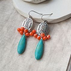 ∴ Boho crystal earrings These earrings are made with beautiful silver coloured charms, orange glass beads and turquoise Howlite drops. ∴ What you need to know » The earrings measure about 7 cm » See photos for a better idea of size If you like my shop but couldn't find exactly what you want, get in touch and we can come up with something together :) Bohemian Orange Jewelry Nickel Free, Bohemian Orange Nickel-free Jewelry, Bohemian Nickel Free Crystal Drop Earrings, Bohemian Nickel-free Drop Crystal Earrings, Orange Bohemian Jewelry For Pierced Ears, Bohemian Orange Earrings With Natural Stones, Orange Bohemian Drop Earrings Jewelry, Orange Bohemian Drop Earrings, Bohemian Orange Teardrop Jewelry