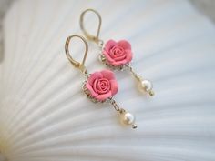 The Listing is for a pair of Hand sculpted Pink Rose Flower Earrings. Different pink colors are available. Material in this Earrings: Rose Flower size is approximately 14-15mm. Attached on Filigree. 6mm Ivory/Cream Swarovski Pearls . Drop a note if you prefer white Swarovski pearls, black glass beads or other colors. The entire length is approximately 4cm. Silver Plated or Antiqued brass Leverback earwires. Note ; For Sterling silver Earwires, only the ear-wires will be in sterling silver. other Pink Rose Design Dangle Earrings, Pink Rose Design Drop Earrings, Pink Rose Earrings, Shade Roses, Flower Hanging, Pink Rose Flower, Blush Rose, Pink Shade, Earrings Pink