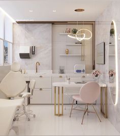 a white bathroom with gold accents and pink chairs in front of the sink, along with a mirror on the wall