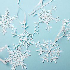 paper snowflakes on a blue background