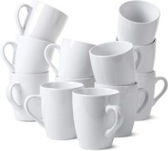 a stack of white coffee mugs sitting next to each other on a white surface