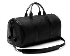 Modern Leather Trim Duffle Bag For Overnight Trips, Luxury Gym Bag With Luggage Sleeve For Travel, Luxury Gym Bag With Large Capacity, Luxury Travel Gym Bag With Luggage Sleeve, Luxury Large Capacity Gym Bag For Travel, Luxury Everyday Gym Bag, Modern Travel Bag With Dust Bag, Modern Travel Bag With Dust Bag Included, Luxury Rectangular Gym Bag For Everyday Use