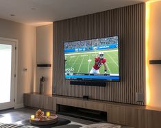 a flat screen tv mounted to the side of a wall