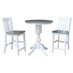 a white table and two chairs sitting next to each other