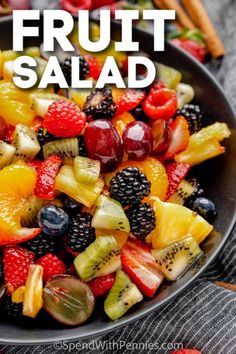 fruit salad in a black bowl with the title overlay reads, fresh fruit salad