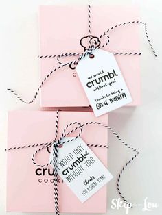 three pink envelopes tied up with twine and some black writing on the front