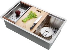 a kitchen sink with cutting board and vegetables in it