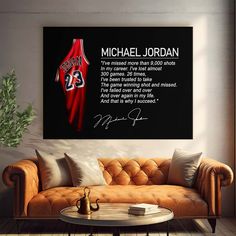 a living room with a couch, table and painting on the wall that says michael jordan