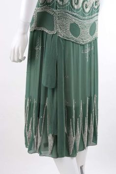 For Sale on 1stDibs - MADELEINE VIONNET c.1924 “Little Horses” Soft Green White Glass Beaded Flapper Dress Circa: 1924 Designer: Madeleine Vionnet Style: Flapper drop waist 1920s Embellished Summer Dresses, 1920s Style Embellished Summer Dresses, Embellished 1920s Style Summer Dresses, 1920s Beaded Evening Dress, Vintage Embellished Green Dresses, Vintage Green Embellished Dress, Art Deco Embellished Dresses For Vintage Style, 20s Clothes, 1925 Fashion